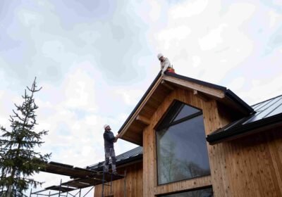 long-shot-men-working-roof-together_11zon